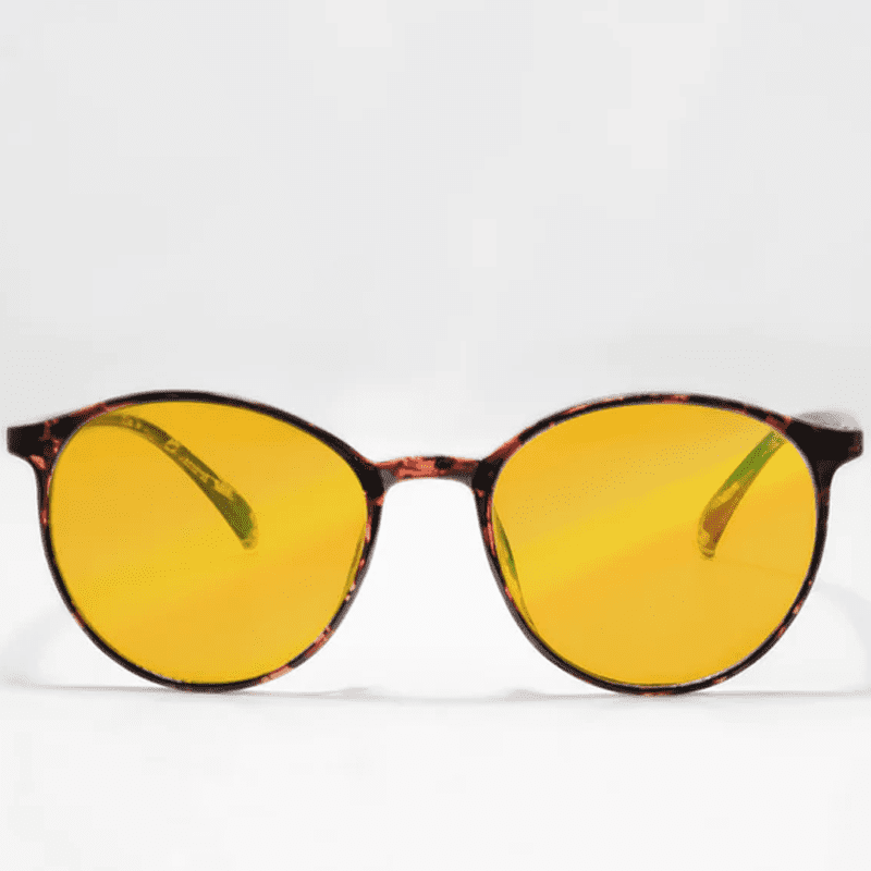 Ocushield Amber blue light glasses with tortoiseshell frames and yellow-tinted lenses, front view against white background.