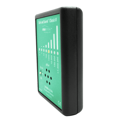 Safe and Sound Classic II electromagnetic field detector with green display showing signal strength bars and numerical readings, side angle view.