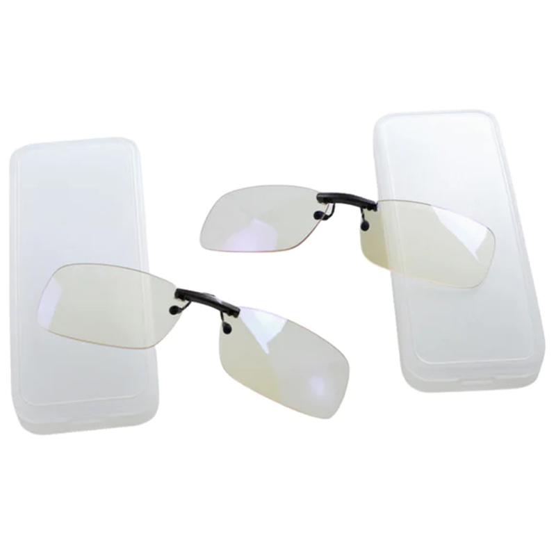 Ocushield Clear All-Day Blue Light Glasses shown as clip-on lenses attached to two smartphone screens, demonstrating versatile wearable usage.
