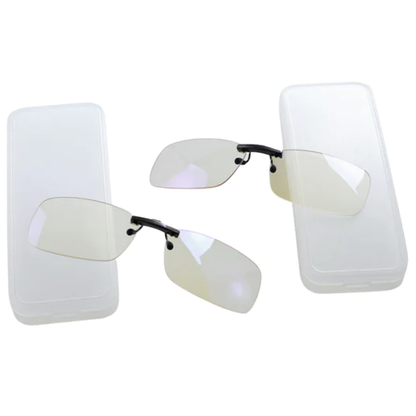 Ocushield Clear All-Day Blue Light Glasses shown as clip-on lenses attached to two smartphone screens, demonstrating versatile wearable usage.