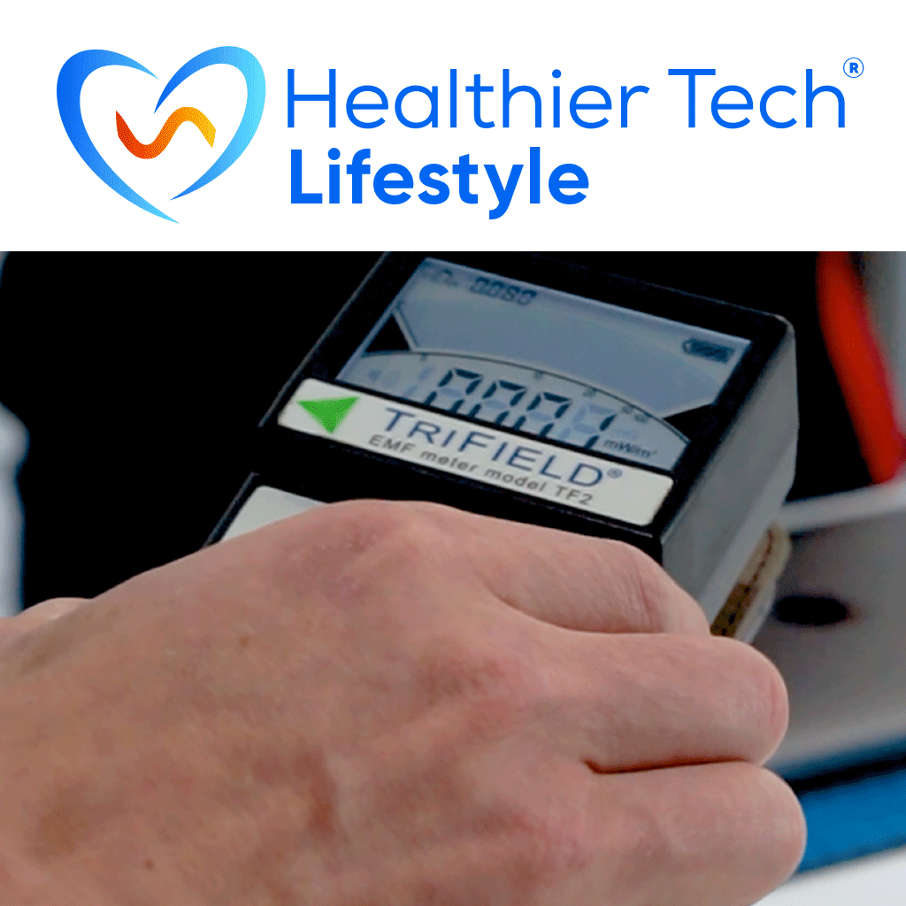 Hand holding TriField EMF meter displaying reading, Healthier Tech Lifestyle logo visible above.