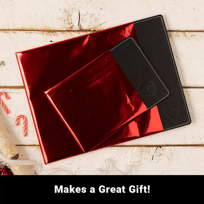 SYB Laptop Pad in red and black displayed with wallets and holiday decorations on white wooden surface, with "Makes a Great Gift!" text below.