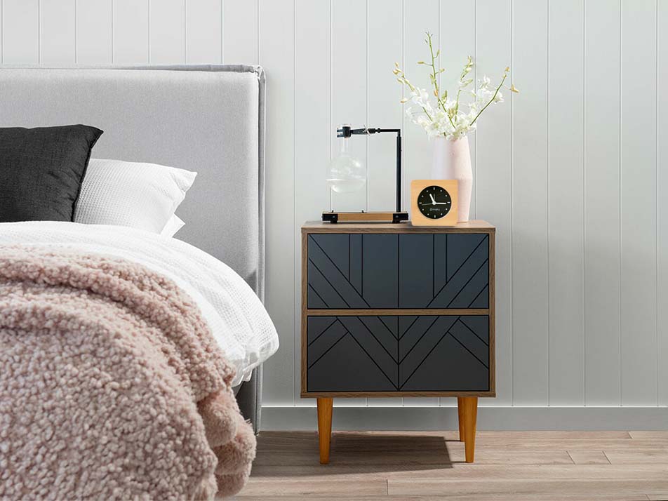 Bagby EMF-Free Minimalist Silent Analog Alarm Clock displayed on a mid-century nightstand next to a bed in a modern bedroom.