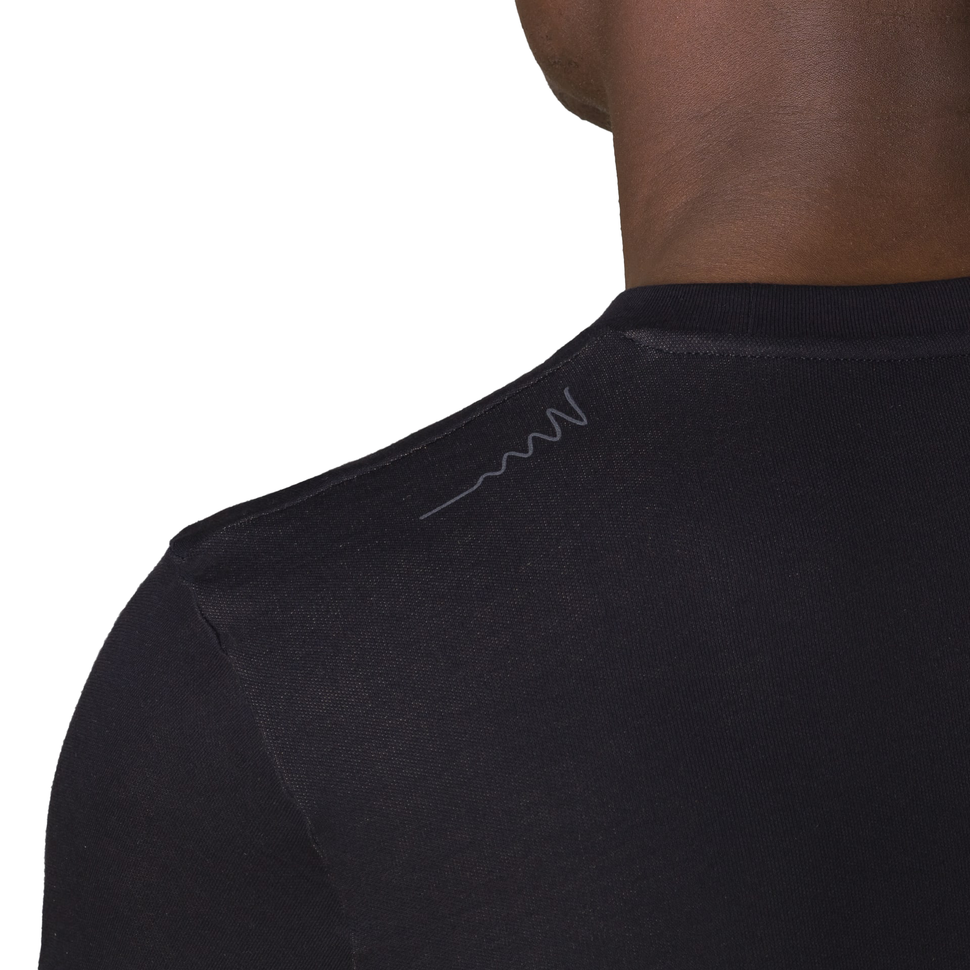 Close-up back view of HAVN WaveStopper T-Shirt 2.0 showing shoulder seam detail and subtle logo on black fabric.