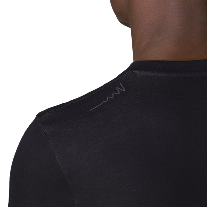 Close-up back view of HAVN WaveStopper T-Shirt 2.0 showing shoulder seam detail and subtle logo on black fabric.