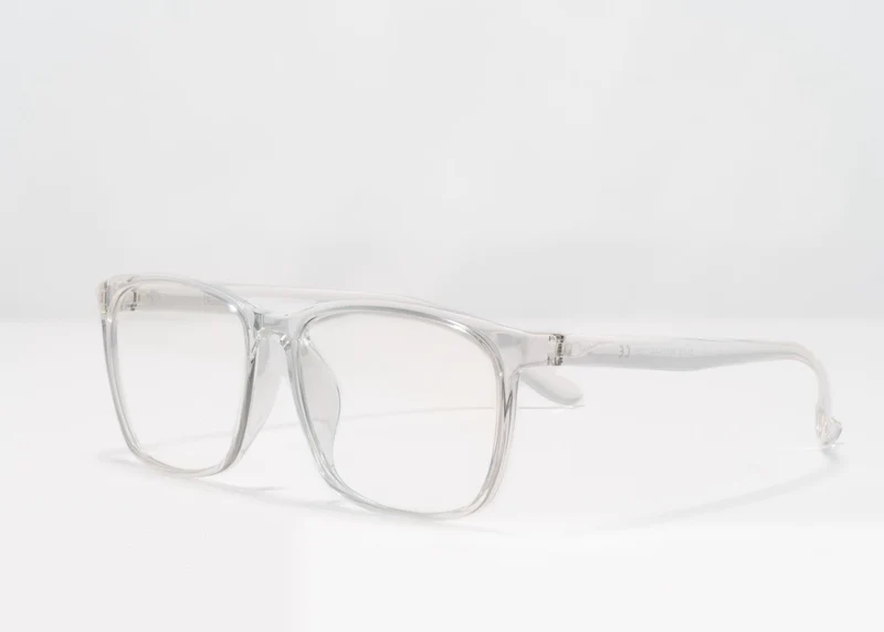Ocushield Clear All-Day Blue Light Glasses with transparent frames and white temples, displayed against a white background.