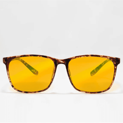 Ocushield Amber blue light glasses with tortoiseshell brown frames and yellow-tinted lenses, front view against white background.