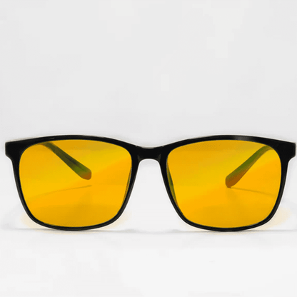 Ocushield Amber blue light glasses with black frames and yellow-tinted lenses, front view against white background.