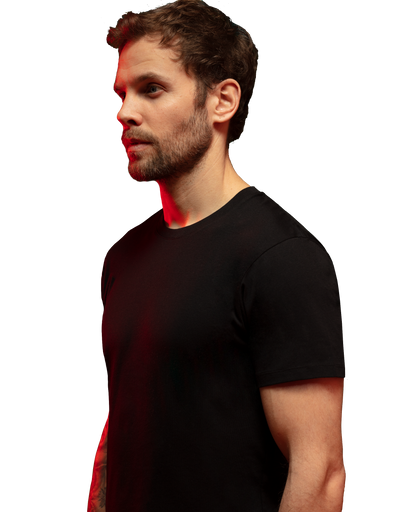 Man wearing black HAVN WaveStopper™ T-Shirt 2.0 shown in profile view with red electromagnetic wave visualization effect.