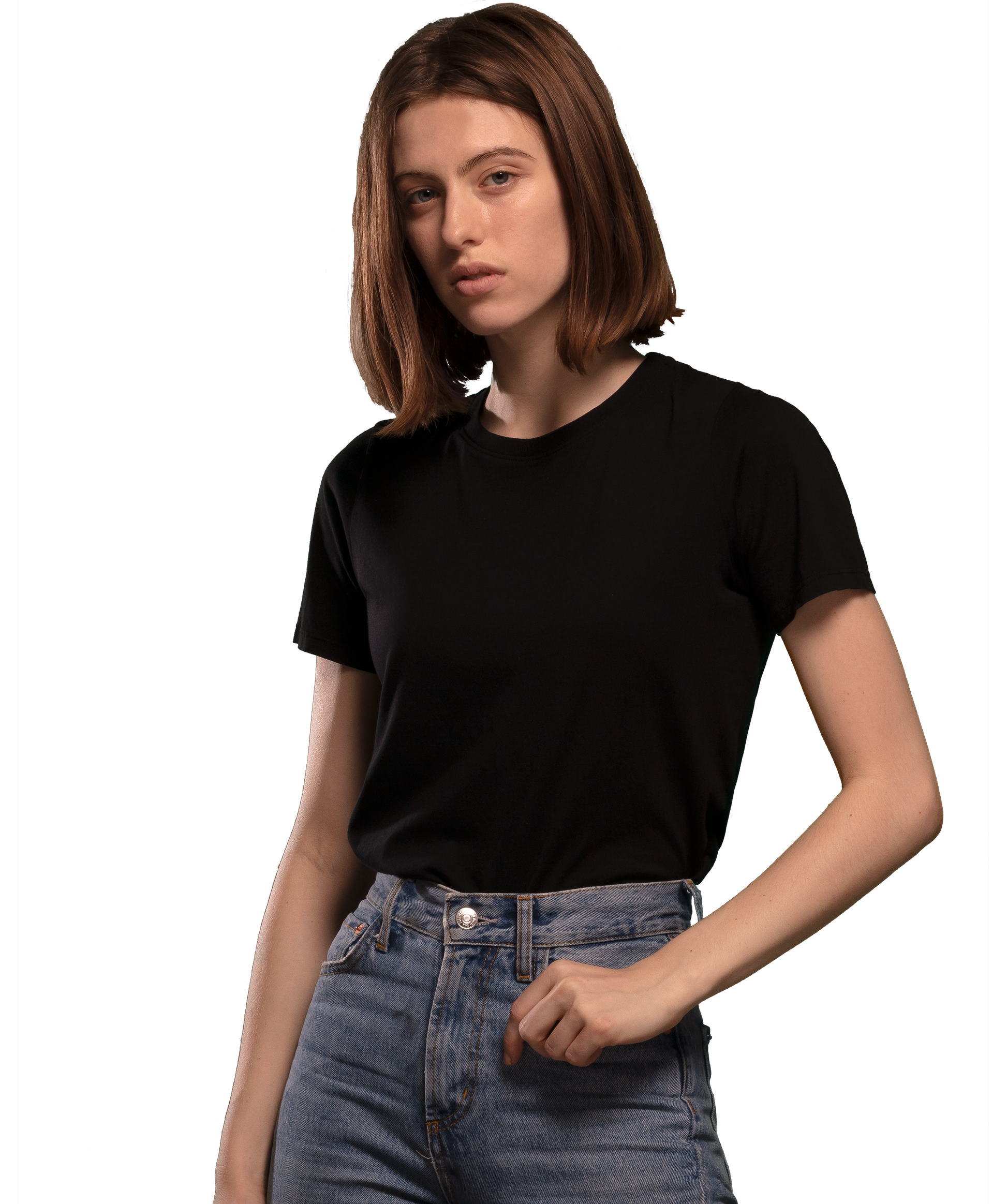 Woman wearing black HAVN WaveStopper™ T-Shirt 2.0 with blue jeans, front view against white background.