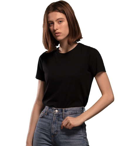 Woman wearing black HAVN WaveStopper™ T-Shirt 2.0 with blue jeans, front view against white background.