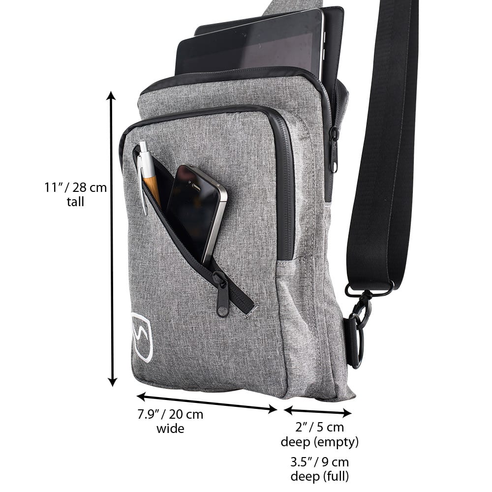 SYB Sling Bag with dimensions displayed: 11"/28cm tall, 7.9"/20cm wide, 2-3.5"/5-9cm deep, holding tablets and accessories.