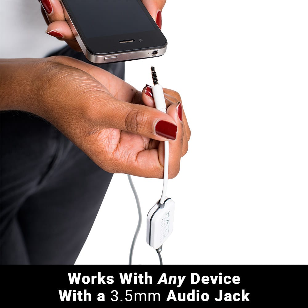 Woman holding smartphone with SYB H.A.R.D. headset adapter connected via 3.5mm audio jack cable.