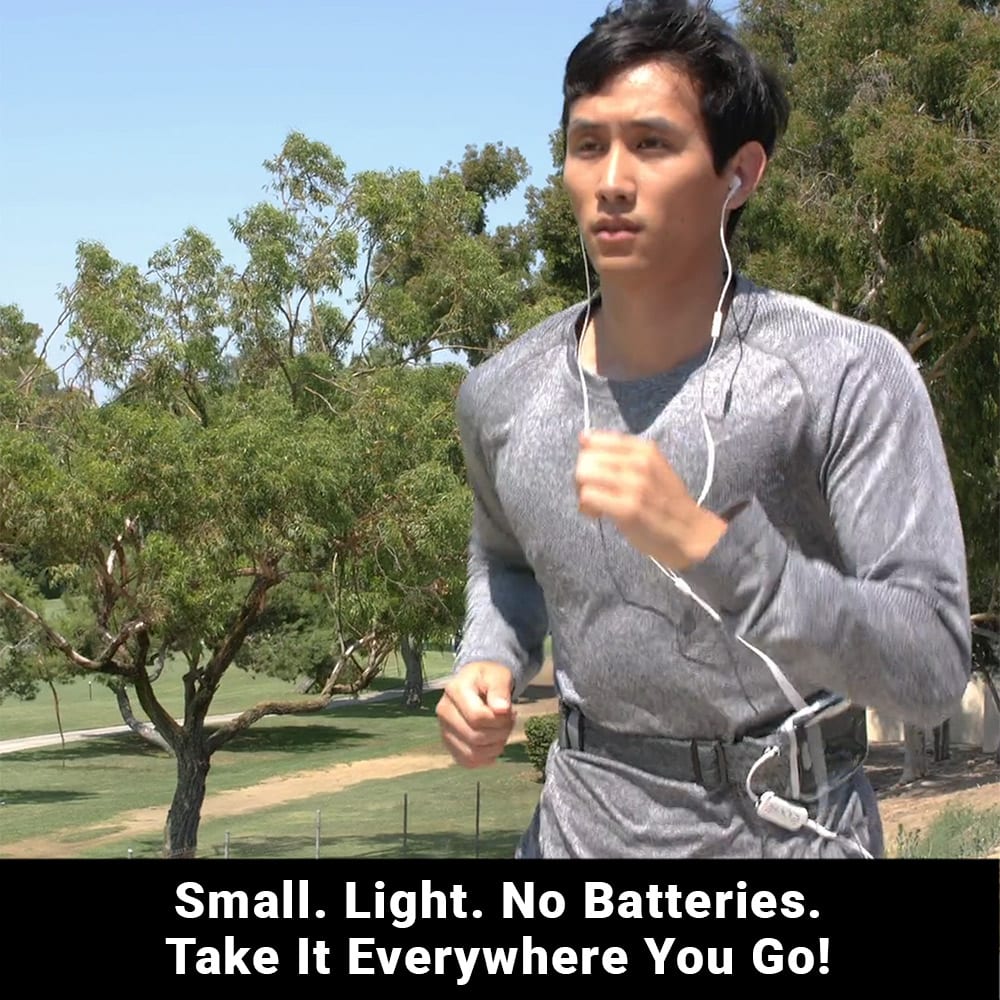 Man jogging outdoors wearing SYB H.A.R.D. headset with white earbuds, demonstrating portable, lightweight design in park setting.