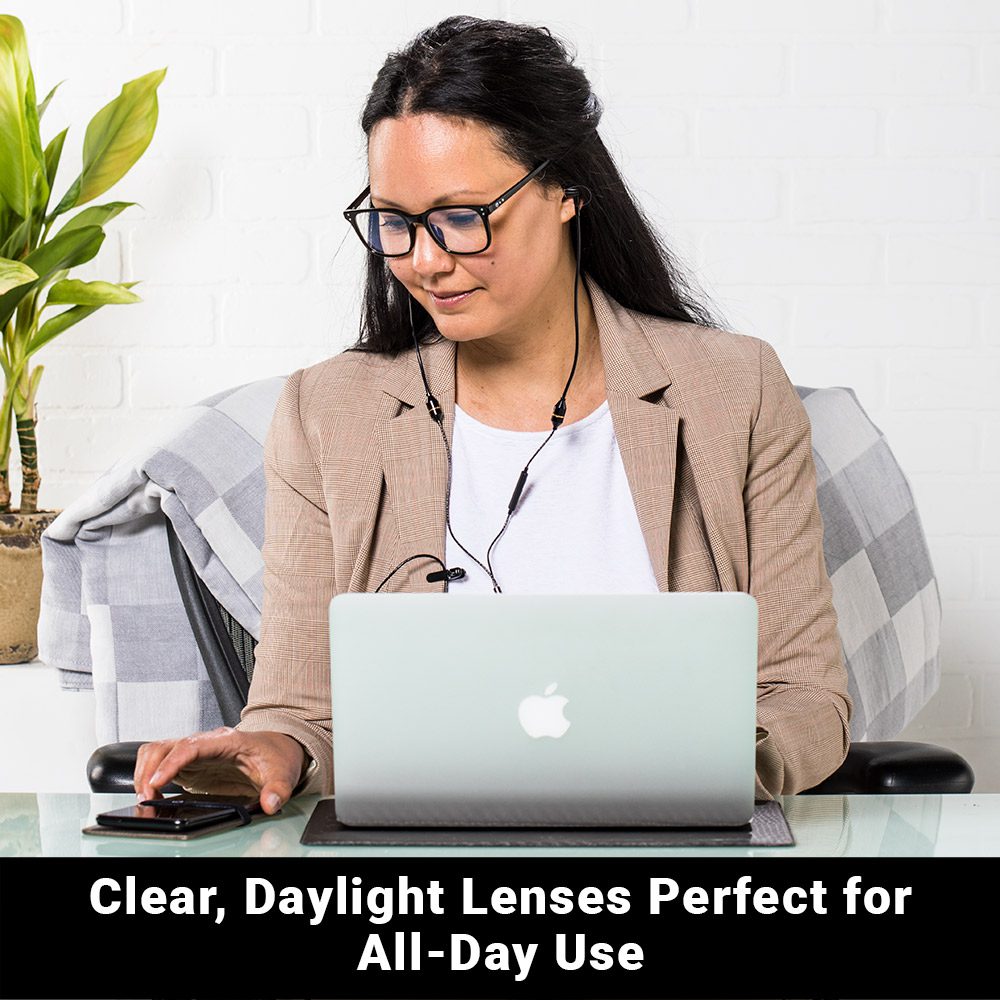 Woman wearing SYB Bluelight Glasses while working at laptop, demonstrating all-day office use with clear daylight lenses.