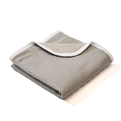 SYB Baby Blanket folded with white binding trim, displaying the soft gray fabric and contrasting white edge detail.