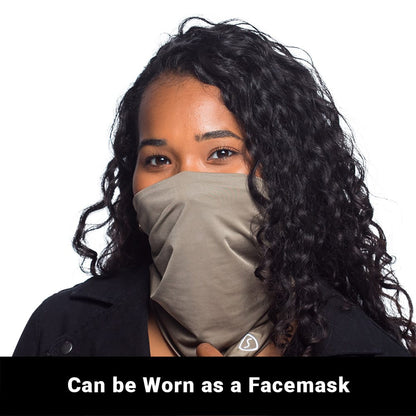 Woman wearing gray SYB Neck Gaiter pulled up as a facemask against white background.