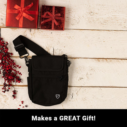 SYB Phone Pouch Deluxe in black displayed on whitewashed wood with red gift boxes and berries, showing "Makes a GREAT Gift"