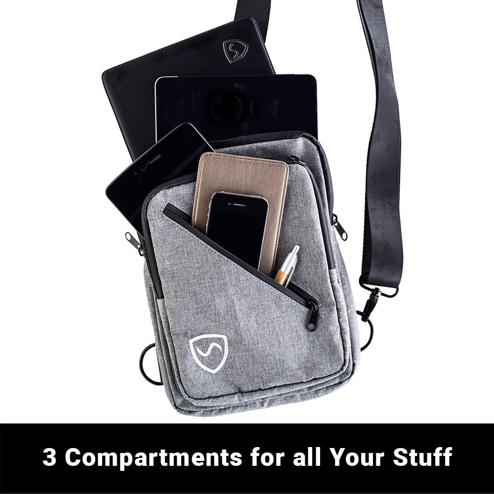 SYB Sling Bag open with multiple compartments displaying smartphone, tablet, wallet, and pen storage capacity.