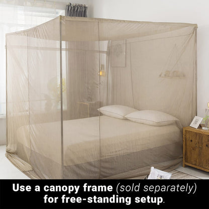 SYB Faraday Bed Canopy draped over queen bed with two pillows, demonstrating free-standing setup over canopy frame in bedroom.