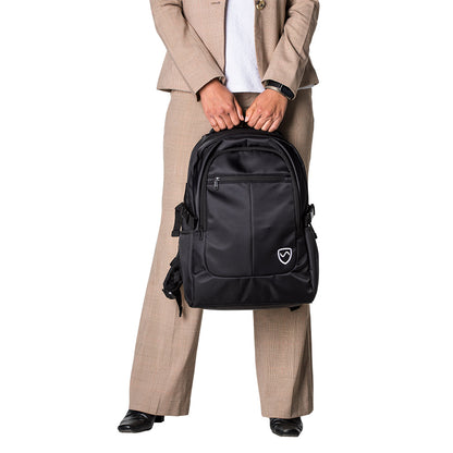 Man in beige business suit holding black SYB Backpack with shield logo, front view.
